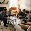 Group of diverse individuals discussing FHA and Conventional loans in a cozy living room
